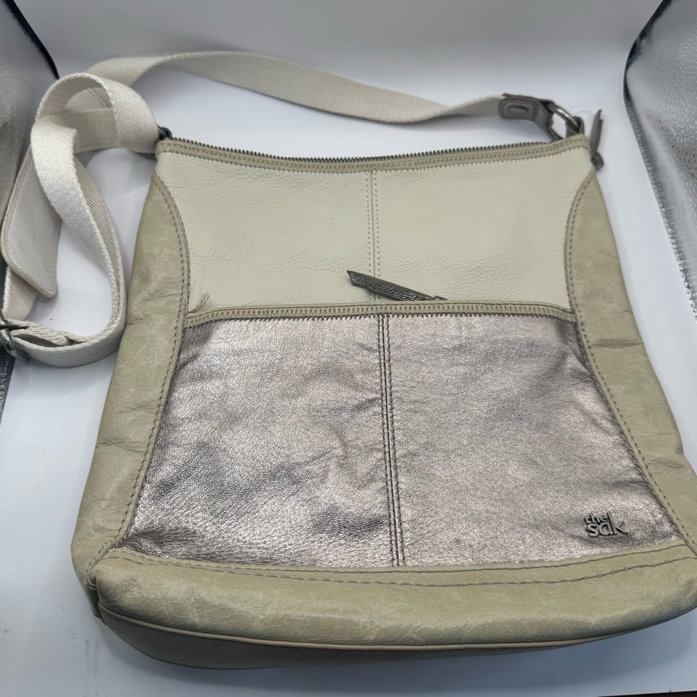 The Sak Iris crossbody bag in a two-toned ivory and silver leather
